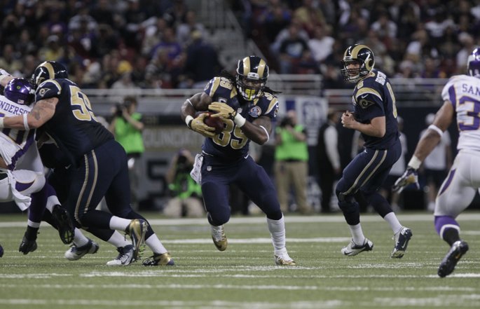 Former Los Angeles Rams running back Steven Jackson runs with the football.